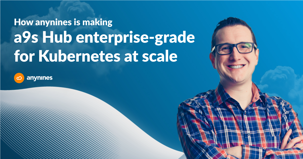 Julian Fischer, CEO of anynines, smiling with arms crossed in a plaid shirt, on a blue header image for the article "How anynines is making a9s Hub enterprise-grade for Kubernetes at scale," with the anynines logo.